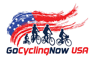 Go Cycling Now US Logo in red, white and blue with cyclists and american flag